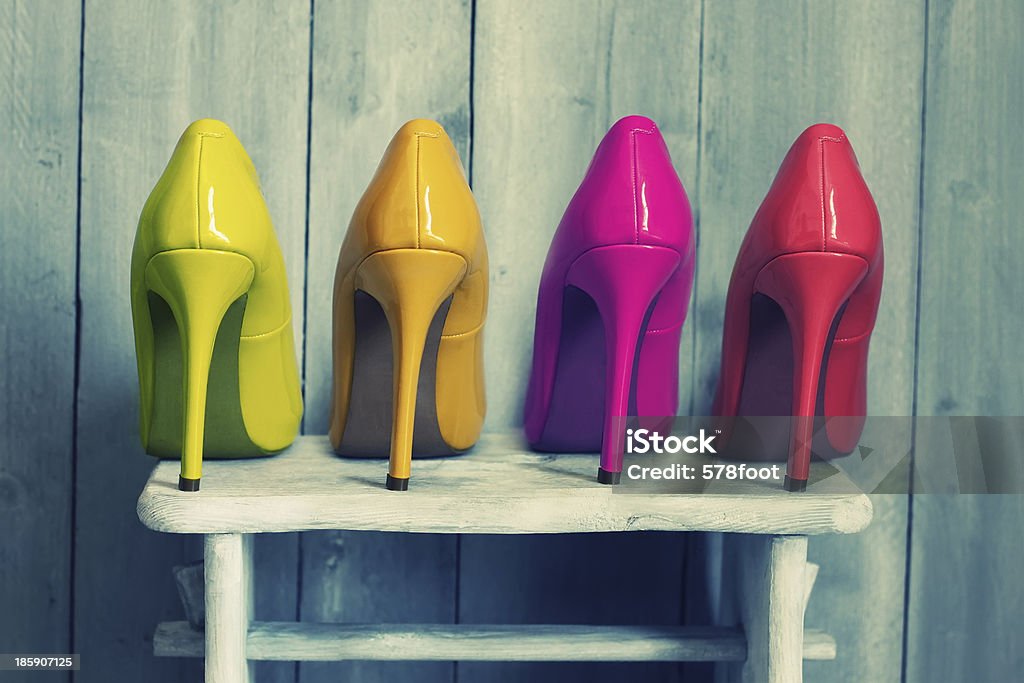 Colours Retro photo of pink, yellow and red shoes Human Foot Stock Photo