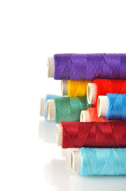 istock Pile of coloured bobbins 185908167