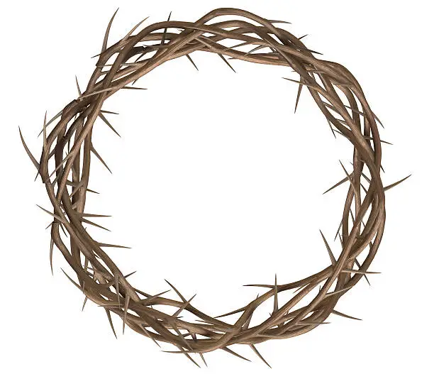 A top view of branches of thorns woven into a crown depicting the crucifixion on an isolated background