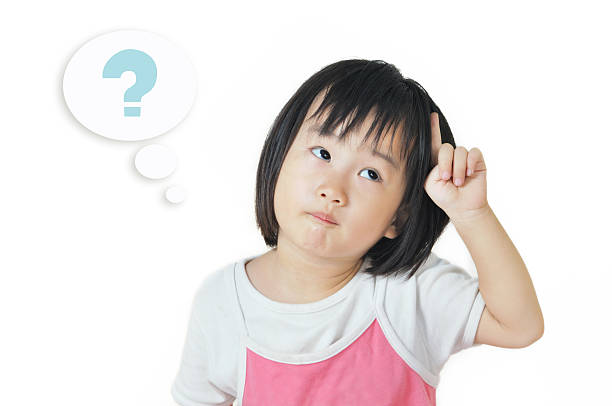 istock asian small child in thoughtful expression with question mark symbol 185911697