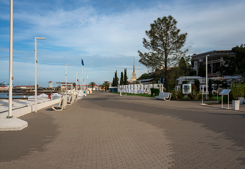 Sochi, Krasnodar Krai, Russia, 05.03.2022: View of the promenade along the Black Sea on Primorskaya street and the Sea station of Sochi on a sunny morning