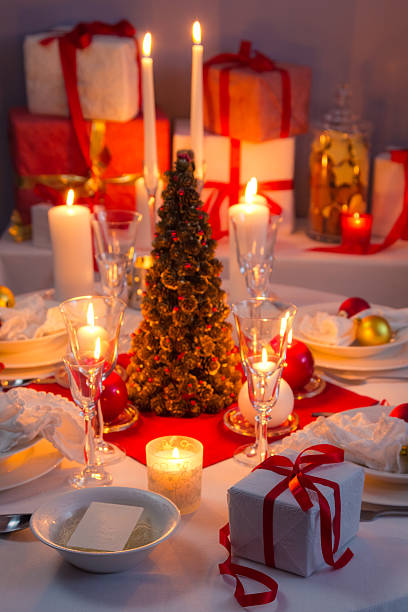 istock Candlelight, wafer and gifts on the Christmas table 185912237