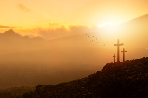 Wooden crosses at sunrise. Easter concept.