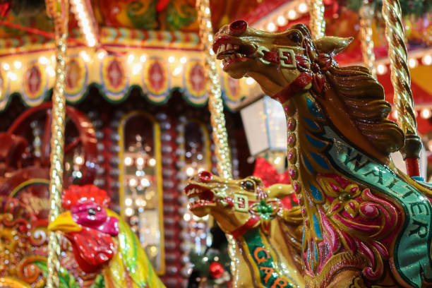 Horses and a cockerel on a funfair carousel