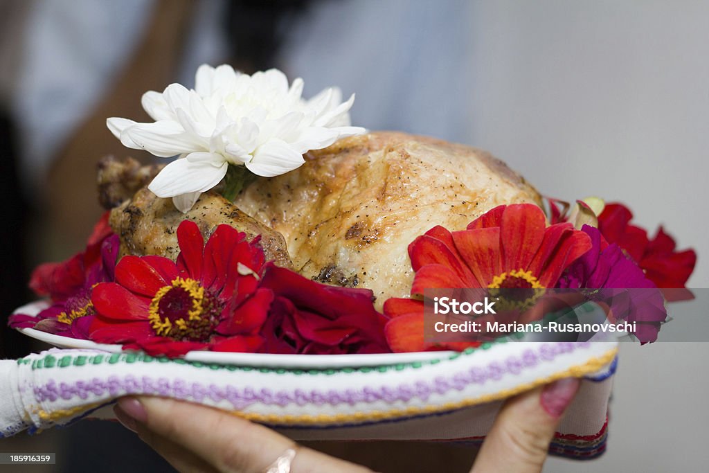 Baked chicken decorated with flowers Baked chicken on a plate decorated with flowers Baked Stock Photo