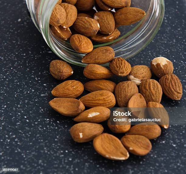 Almonds Stock Photo - Download Image Now - Almond, Backgrounds, Brown