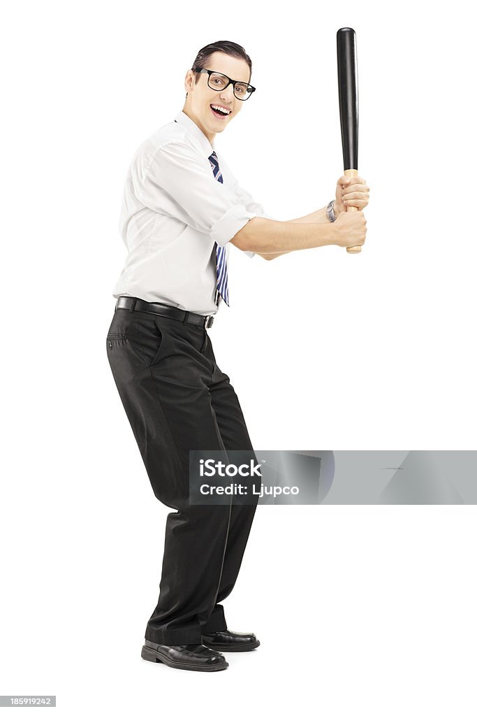 Person with a baseball bat prepared to strike Full length portrait of a person with a baseball bat prepared to strike isolated on white background Activity Stock Photo