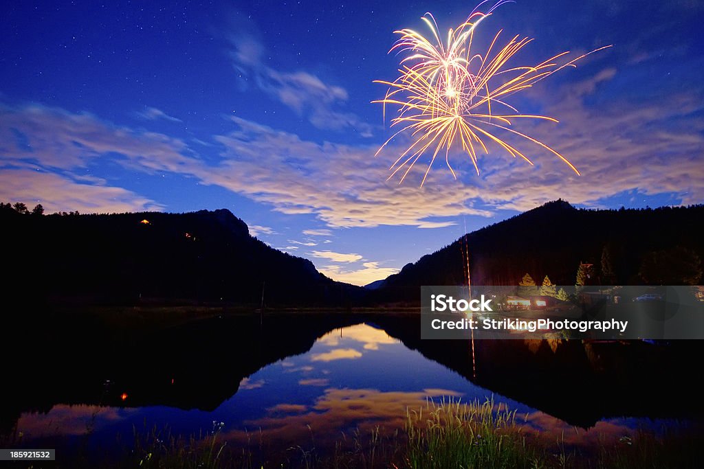 Rocky Mountains Private Fireworks Show Private Fireworks show high up in the Colorado Rocky Mountains looking out into the plains. Firework Display Stock Photo