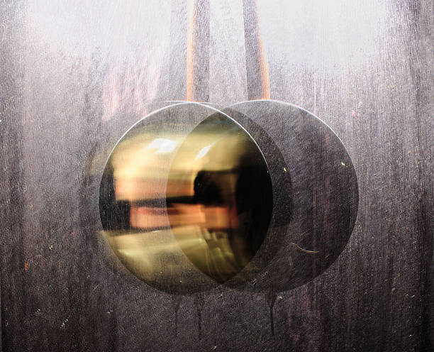 istock metal pendulum clock swinging in wood background 185921772