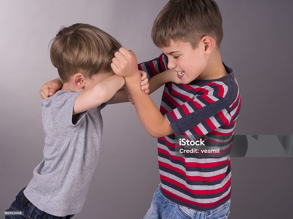 Two angry brothers fighting eachother boys are boys everwhere Child Stock Photo