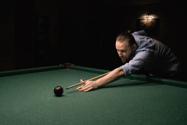 istock Handsome millennial man playing billiard. Playing billiard concept 1859231915