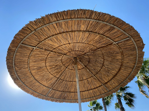 Sun umbrella on the beach, relaxing time