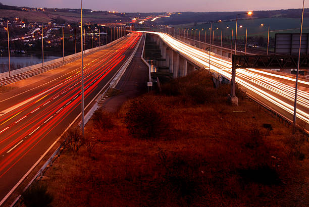 Vehicle light trails Light trails made by vehicles travelling on a motorway in England UK m2 machine gun photos stock pictures, royalty-free photos & images