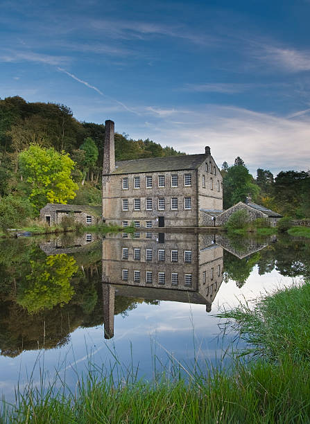 victorian mill and pond gibson mill in the heart of the national trust woodland of Hardcastle Crags near to Hebden Bridge in West Yorkshire, it is former textile mill which now runs on an entirely self sustainable basis. burton sussex stock pictures, royalty-free photos & images