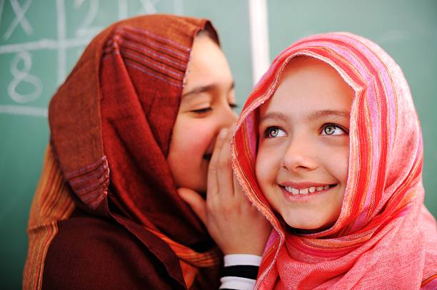 Cute lovely school children at classroom having education activi Cute lovely Arabic school children at classroom having education activities arabian girl stock pictures, royalty-free photos & images