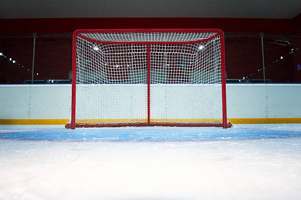 istock Hockey goal on ice rink 185926401