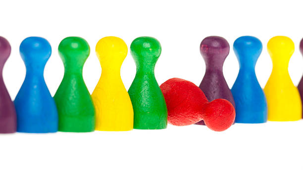 istock Colorful row of pawns, red fallen 185926412