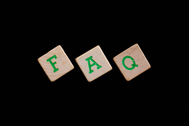 istock Green letters on old wooden blocks (FAQ) 185926423
