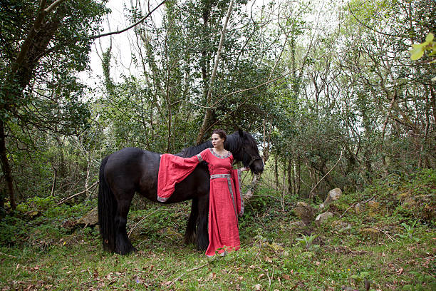 Irish country side lady in medieval garb with an Irish cobb Horse 