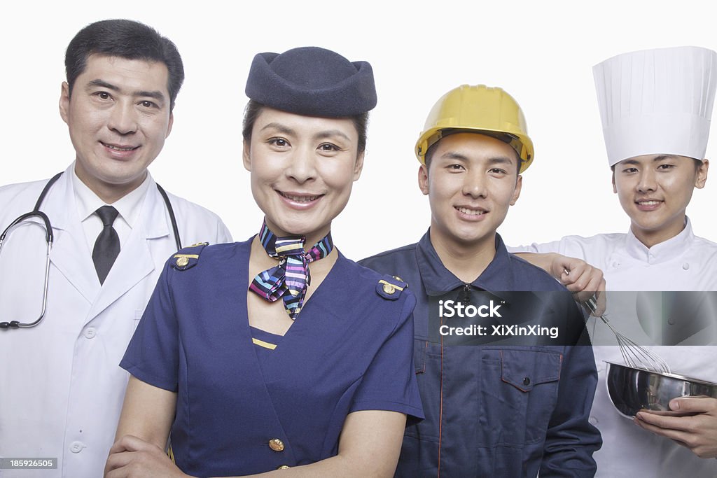 Médico, azafata, Trabajador de construcción y Chef- Foto de estudio - Foto de stock de Chino - Oriental libre de derechos