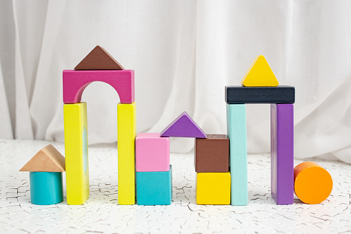 Colorful building blocks arches, on white background