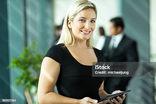 Young Businesswoman Using Tablet Computer Stock Photo - Download Image Now - Adult, Adults Only, Beautiful People