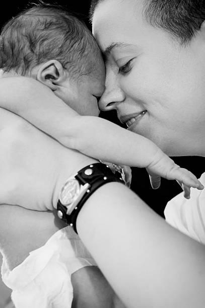 istock Mother holding up baby 185927629
