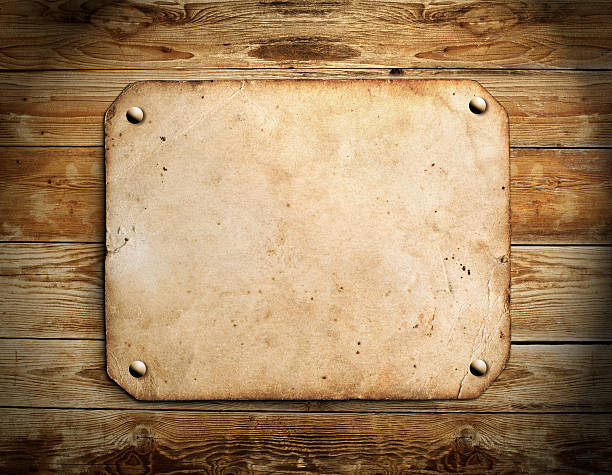 istock Old paper on the wood background 185927637