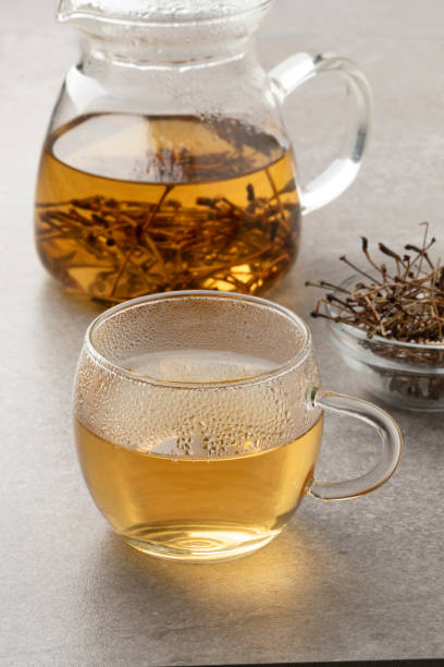 istock Cup with tea made from dried cherry stalks close up 1859278795