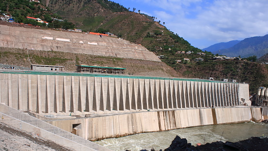 The Neelum–Jhelum Hydropower Plant is part of a run-of-the-river hydroelectric power scheme in azad Kashmir Pakistan, designed to divert water from the Neelum River to a power station on the Jhelum River. The power station is located 42 km (26 mi) south of Muzaffarabad, and has an installed capacity of 969 MW. Construction on the project began in 2008 after a Chinese consortium was awarded the construction contract in July 2007. After delay of many years, the first generator was commissioned in April 2018 and the entire project was completed in August 2018 when the fourth and last unit was synchronized with the national grid on 13 August and attained its maximum generation capacity of 969 MW on 14 August 2018. It will generate 5,150 GWh (gigawatt hour) per year at the levelised tariff of Rs 13.50 per unit for 30 years.