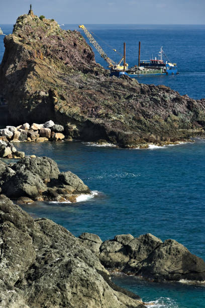 istock Barge on the Ligurian Sea carries materials. 1859294955