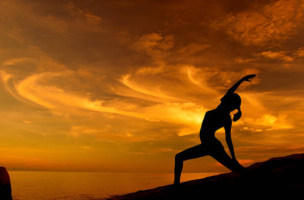 istock Sunrise yoga at beach 185930739