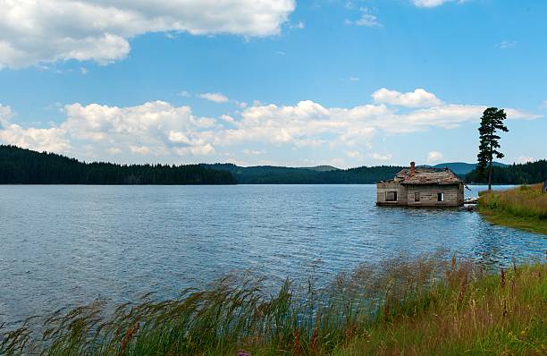 istock mountain lake flood house 185930933