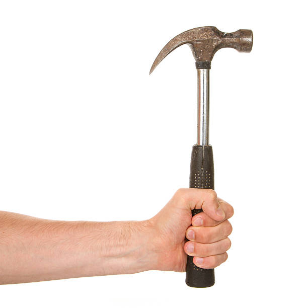 istock Man holding a old metal hammer 185931021