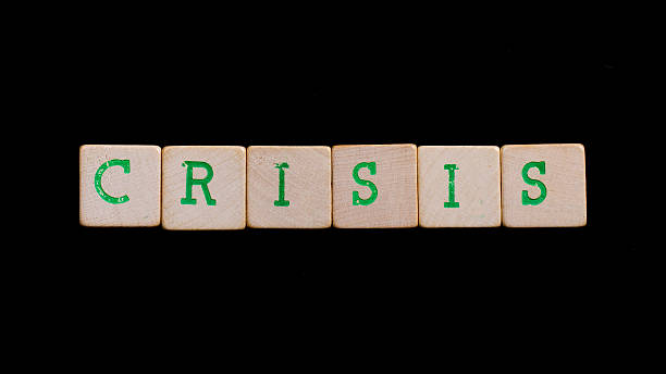 istock Letters on wooden blocks (crisis) 185931025