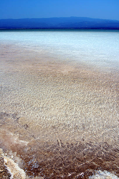 Lake Assal, Djibouti: water and salt - mountains around the saline lake, part of the Afar Depression - photo by M.Torres