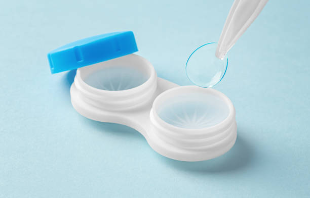 istock Contact lenses with tweezer and container on light blue background 1859328049