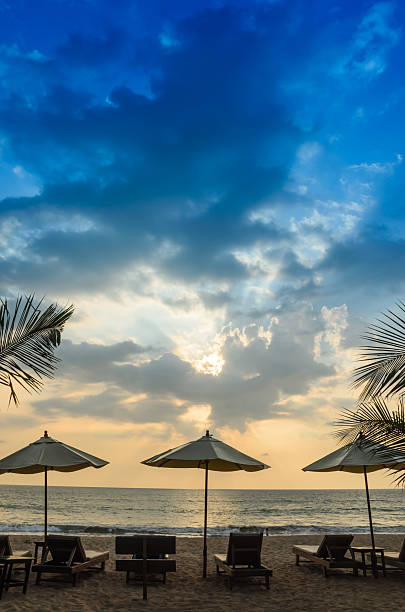 istock Silhouettes of beach umbrellas sunset and sky 185935609