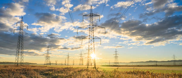 istock Electric power lines at sunrise 1859359593