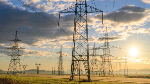 istock Electric power lines at sunrise 1859360097