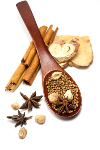 The spice set on the wood spoon with white background