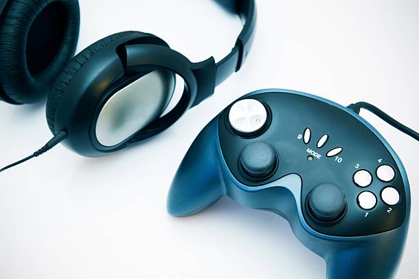 istock Gamepad and headphones on white background 185936800