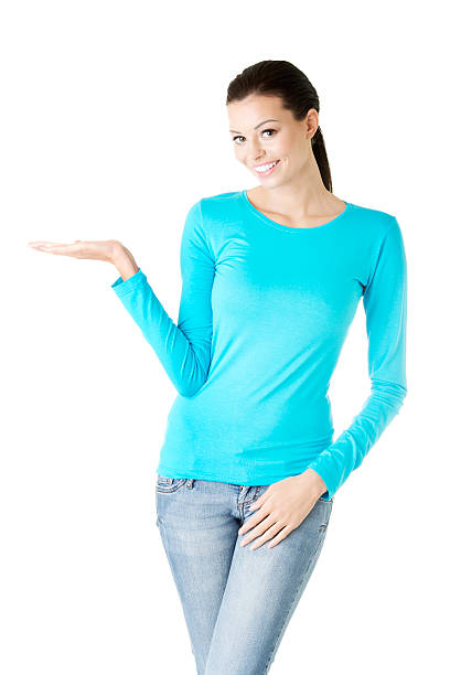 istock Attractive young woman presenting copy space on her right. 185936896