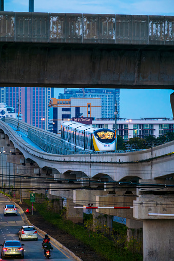 Bangkok Thailand-December 5: New yellow line metro train on monorail arrive to station on evening