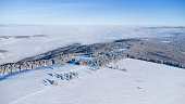 Snow covered mountain range with atmospheric inversion weather in the valley