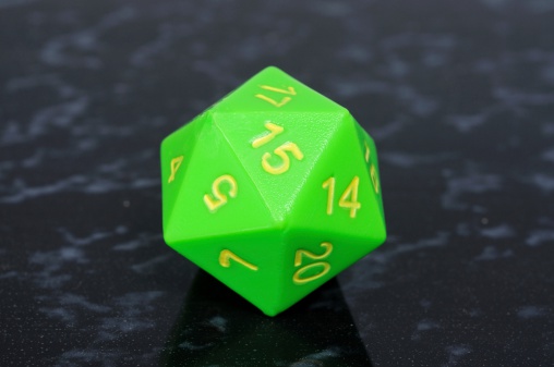 Green icosahedron 20 sided shaped numbered die, England, UK, Western Europe.