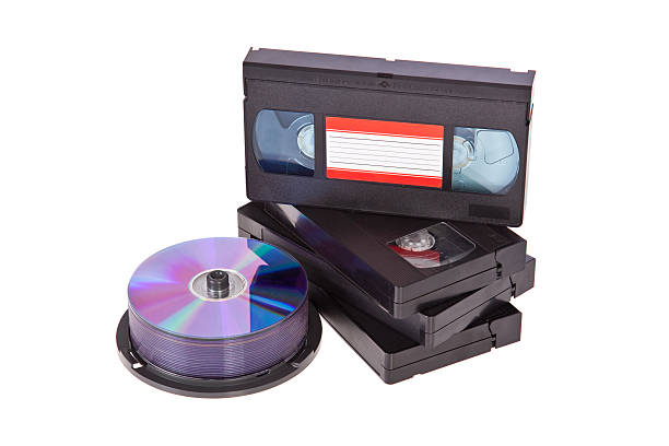 istock Video tapes with a DVD disc isolated on white 185941510