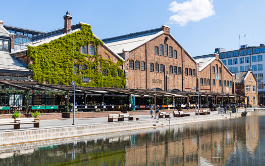 Trondheim, Norway - June 26, 2023: Old port Elvehavn in Trondheim, Norway now used as tourist area with restaurants and shops