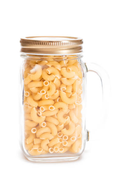 istock Uncooked Chifferi Rigati Pasta in Glass Jar Isolated on White 1859424807