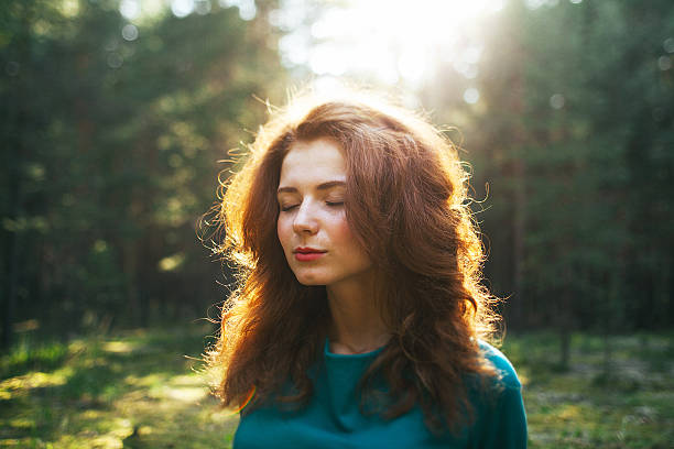 girl in the forest at sunset